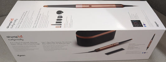Dyson airwrap hair styling tool packaging on a gray surface