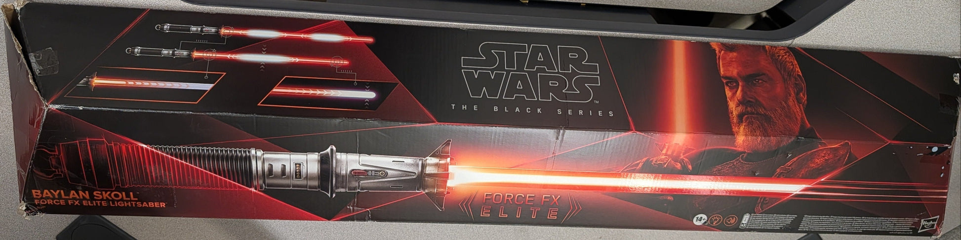 Star Wars-themed desk with lightsaber design on a gray surface